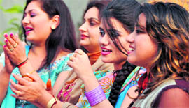 Members of the Basant Ladies Club celebrate Basant Panchami in Ludhiana on Monday.