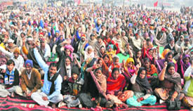 Lal Jhanda Punjab Bhatha Mazdoor Union workers stage a protest against rising prices at Grain Market in Ludhiana on Monday.