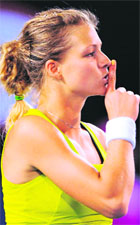 Maria Kirilenko gestures to the crowd after beating Maria Sharapova on Monday.