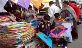 Children buying kites on the eve of Basant Panchami in Bathinda on Tuesday.