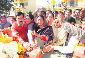 Members from Hindu and Muslim communities lay the foundation of a temple after resolving a land dispute in Dehradun