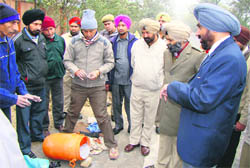 Officials of the bomb disposal squad defuse an IED near Nabha on Tuesday.