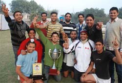 Jubilant teammates of the National College, Bhikhi, after lifting the trophy in Bathinda 