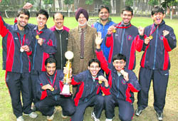 Members of the Panjab University badminton (men) team after winning the overall badminton championship in Chandigarh on Wednesday.