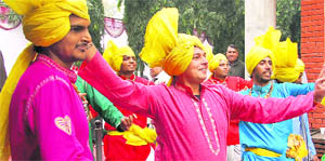 Folk artistes perform on Basant Panchami at Jat Bhavan, Chandigarh, on Wednesday.