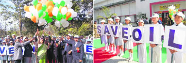 Uttarakhand Governor Margaret Alva releases balloons; and (right) children hold placards during the Oil Conservation Fortnight at the Indian Institute of Petroleum, Dehradun, on Wednesday.