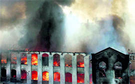 Smoke and flames billow out of Gold Mohar Mill at Dadar in Mumbai on Wednesday