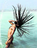 A man takes a dip at Sangam on Basant Pachami in Allahabad on Wednesday