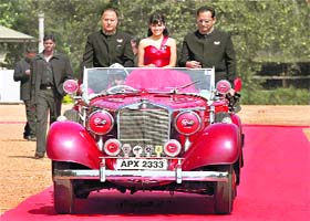 VIRGIN OUT: Bollywood actress Genelia D'Souza (C) in a vintage car during the launch of the new GSM service in Bangalore