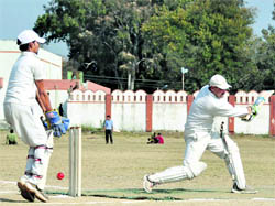 A batsman plays a shot during a match of the 58th District Cricket League 