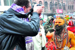 A foreign photojournalist clicks a 