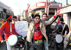 Residents rejoice in Jammu on Thursday over the decision of the Centre to lift the ban on pre-paid cellphone services in the state
