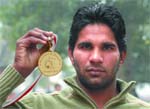 Devender Singh shows his gold medal, which he won during the Commonwealth Judo Championship in Singapore