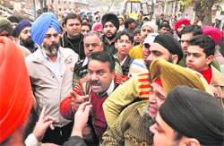 Angry shopkeepers argue with ATP SS Bindra during the demolition drive in Ludhiana on Thursday.