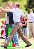 Britains Prince William bowls while Brett Lee looks on in Flowerdale