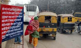 Violating rules, private buses and auto-rickshaw drivers pick up and drop passengers at the prohibited point on the Majitha Road junction in Amritsar.