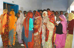 Voters wait for their turn at a rural polling station at Suratgarh on Friday. 