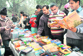 Students buy books at a bookstall on the birth anniversary of Swami Vivekanand and Subhas Chandra Bose at Student Centre, Punjab University, Chandigarh, on Friday. 