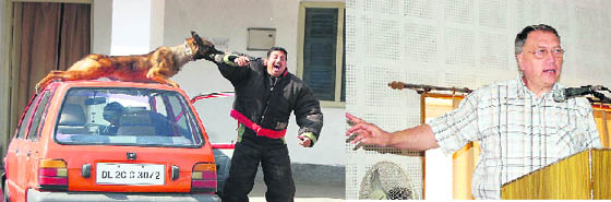 A dog tackles an armed attacker at a demonstration on dogs for security in Dehradun on Friday; and (right) Dr Andre Vandergeten, a renowned international expert on dogs, delivers a lecture at a seminar.