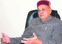 Chief Minister Prem Kumar Dhumal addressing the media at Dharamsala