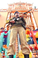 Security personnel keep vigil outside Raghunath Temple in Jammu on Friday in view of Republic Day