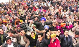 Members of the Employees Joint Action Committee hold a demonstration in Jammu