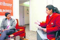 A student in conversation with Kamleshwar Mishra, DTM, in Jammu