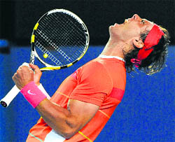 Rafael Nadal celebrates after beating Philipp Kohlschreibe