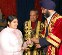 Finance minister Manpreet Badal honouring PU toppers from Gopi Chand Arya Mahila College Abohar.