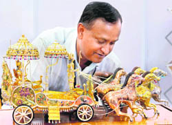 A golden chariot worth Rs 1 crore on display at the gem and jewellery exhibition in Chennai on Saturday.