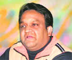 Anshoo Saxena, Principal, FCI, addresses mediapersons in Dehradun on Saturday.