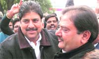 Ajay Singh and Abhey Singh Chautala hug each other after the latters victory in Ellenabad
