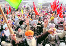 Farmers protest against the state governments decision on subsidy on electricity, in Amritsar on Saturday