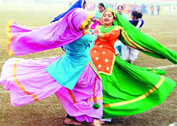 Schoolgirls perform gidda during preparations for the Republic Day celebrations at Guru Nanak Stadium in Amritsar on Saturday