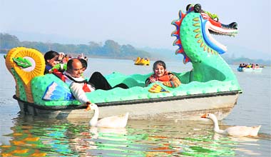 Tourists have fun at Sukhna Lake in Chandigarh on a bright Sunday
