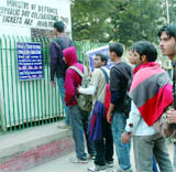 Boys queue up to buy tickets for the Republic Day Parade at Jantar Mantar in New Delhi on Sunday.