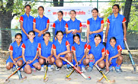 Members of the Dehradun girls hockey team pose for a picture after winning the Panchayat Sports Hockey tourney in Dehradun on Sunday.