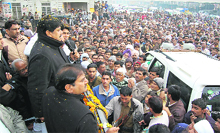 Abhey Singh Chautala with his brother Ajay Singh during a victory march in Ellenabad on Sunday.