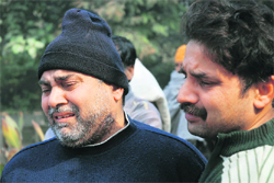 Kishori Lal, father of the deceased, breaks down outside the trauma centre in Karnal on Sunday. 