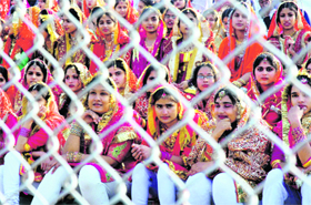 Students belonging to different schools take part in the Full Dress Rehearsal for the Republic Day Parade in Jammu on Sunday. 
