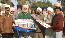 DIG JK Jain presenting sports kits to de-addicted persons of Kothe Piple village 