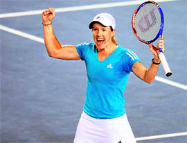 Justine Henin celebrates after beating Yanina Wickmayer 7-6 (7/3), 1-6, 6-3 on Sunday