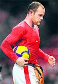 Manchester United's Wayne Rooney leaves the pitch with the match ball after scoring all four goals in the 4-0 victory against Hull City at Old Trafford on Saturday