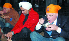 Canadian MP Bob Dechert partakes langar at the Golden Temples Langar Hall.