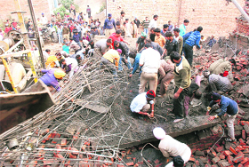 Rescue work underway after an under-construction shop at Vishavkarma market collapsed in Bathinda on Monday. 