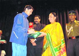 Winner of a marathon race of Sports School receives award from state Governor Margaret Alva in Dehradun
