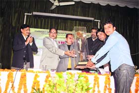 The Banaras Hindu University (BHU) team receives the trophy of a national debate held at the Gobind Ballabh Pant University of Agriculture and Technology, Pantnagar