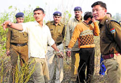 Haridwar SSP Sanjay Gunjial with the accused involved in the rape of a minor girl at the scene of the crime in Haridwar on Sunday