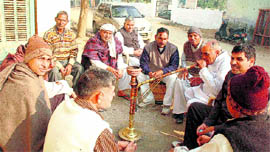 Village elders dwell upon the latest political situation at a chaupal in Gurgaon district.