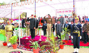 Chief Minister Prem Kumar Dhumal taking salute on Himachal Day at Bijahri near Hamirpur on Monday.